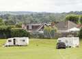 Travellers set up camp at play area