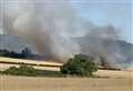 Fire spreads over corn field