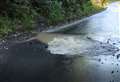 Huge water leak blocks road