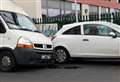 Van crashes into several parked cars