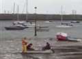 Two teenagers in a boat become stuck in mud