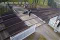 Girl caught on CCTV lying on railway tracks