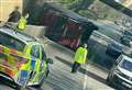 Delays as overturned HGV blocks road after striking bridge