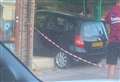 Car crashes through Papa John’s shop window