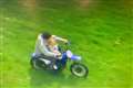 Shocking image shows father riding bike with child allegedly balanced on lap