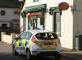 Hunt for armed robbers after post office raid