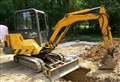 Man dies after digger overturns in field