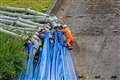 In Pictures: Work to repair damaged reservoir continues one year on