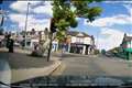 Collapsing tree narrowly misses pedestrians as it falls on road