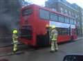 Bus on fire outside railway station