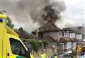 Crews tackle raging house fire