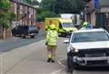 Major road closed after car smashes into house