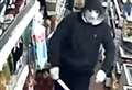 Terrifying photos of masked knife-man who held up shop