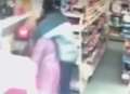 Terrifying moment store raider holds knife to woman's throat