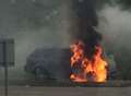 Car blaze on roundabout