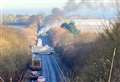 Road blocked after bus goes up in flames