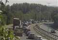 Motorists queue in sweltering heat after smash between lorry and cars