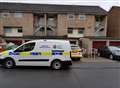 Flats taped off after woman's body found