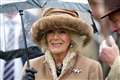 Queen Consort enjoys day at the races despite the drizzle