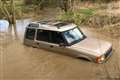 Family with baby rescued from roof of 4×4 stuck in floodwater