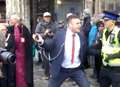 VIDEO: Police seize prankster dancing in front of Archbishop