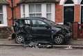 Car abandoned after smashing into wall