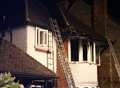 Pair rescued from roof of blazing house after 'candles start fire'