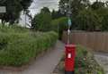 Police have led a woman to safety from a railway bridge