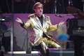 Sir Elton John putting piano, jumpsuit and platform boots up for auction