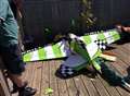 Model plane narrowly misses hitting woman in crash