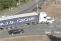 Car and lorry in crash on roundabout