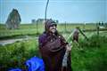 Drizzly dawn after shortest night for Stonehenge solstice faithful