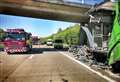 Motorway lane closed after lorries collide