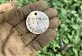 Military dog tag found by metal detector in cabbage field