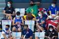 Tom Daley knits in the stands during women’s Olympic diving final