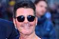 Simon Cowell in hospital after breaking back in bike fall