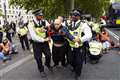 Public clash with Just Stop Oil protesters blocking east London road