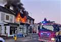 Shop building engulfed in flames