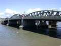 Man on bridge coaxed down