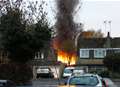 Firefighters extinguish burning shed