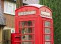 Red phone boxes facing the axe