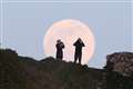 In Pictures: Dazzling pink supermoon delights stargazers