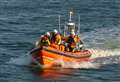 Kitesurfer rescued from rocks