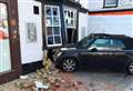 Mini crashes into historic town centre pub