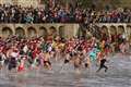 Swimmers don festive outfits for Boxing Day dips for good causes