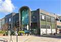 Woman ‘falls from shopping centre balcony’ onto pensioner