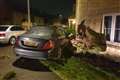 Police seek two who fled after crashing car into family home