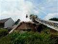 Crews tackle thatch blaze