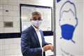 Keep on wearing face masks, London mayor tells commuters