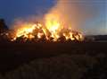 Firefighters battle huge straw blaze